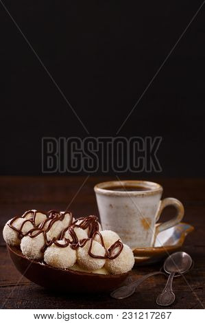 Chocolate Egg Ith Filling For Easter On Wooden Background