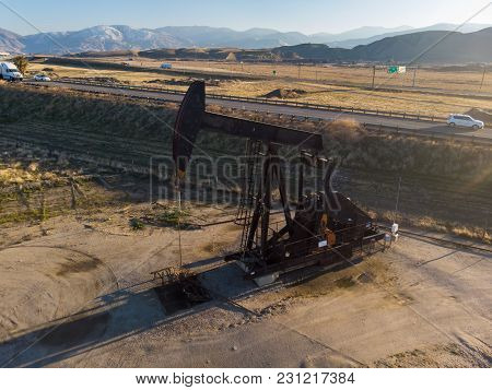 Oil Derrick In The Desers Pumping Wti Oil