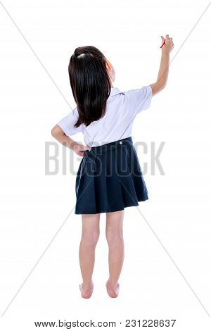 Full Body. Back View Of Young Preschool Child In Uniform Standing Akimbo. Asian Girl Writing With Re