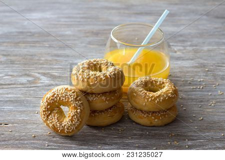 Traditional Greek Easter Biscuits Paskhalina Kuluria With Sesame Seeds On A Wooden Table, Selective 