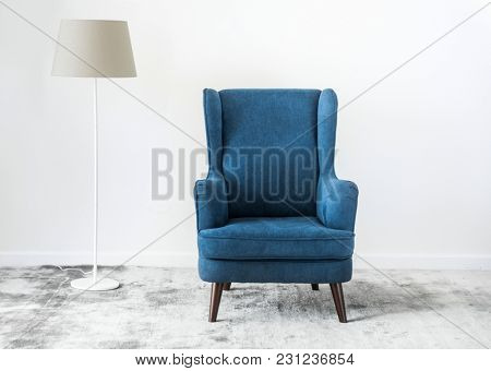 Wing back chair on a carpet no people