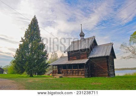 Russian wooden historical house on frass