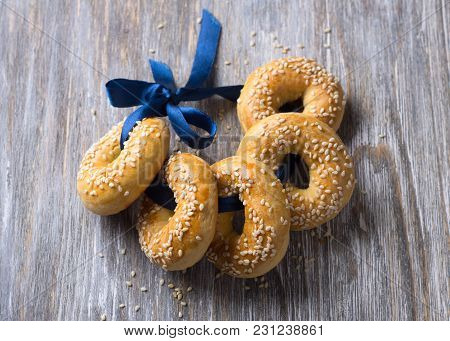 Traditional Greek Easter Biscuits Paskhalina Kuluria With Sesame Seeds On A Wooden Table, Selective 