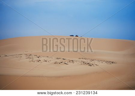 White Sand Dunes Muine In Vietnam With Tourists In The Summer