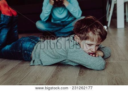 Angry Stressed Child And Tired Father At Home