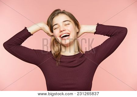 Woman Smiling With Perfect Smile And White Teeth On The Pink Studio Background. Pretty Young Girl. S
