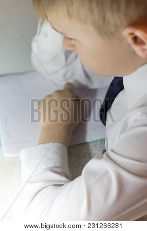 A Disgruntled Schoolchild Boy Thinks About Education