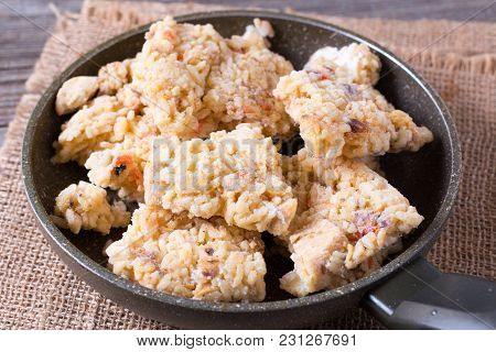 Frozen Pilaf In A Frying Pan. A Dish Of Rice With Meat.