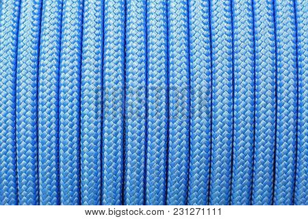 Blue Background Of A Synthetic Rope On A Babin