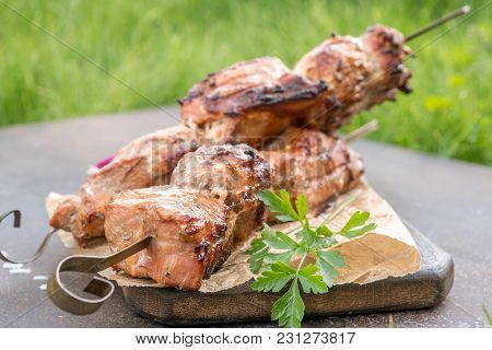 Grilled Shish Kebab Or Shashlik Pork Meat On Skewers Closeup On White Background
