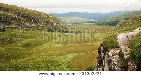 Green Hills And The Road On The Hillside. A Scenic View Of A Kerry Mountains And Surrounding Areas I