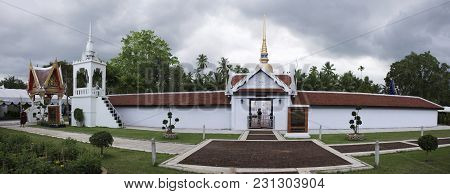 Thai People And Foreigner Travelers Visit With Praying Golden Chedi And Buddha At Wat Phra That Sawi