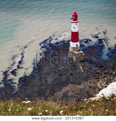 Beachy Head, Sussex, Uk - May 11 : The Lighthouse In Low Tide At Beachy Head In Sussex On May 11, 20