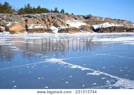 Rocky Coast Of Hanko And Ice Of The Gulf Of Finland On A Sunny February Day. Finland