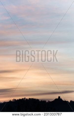 Sunrise Sky With Forested Mountain Silhouette With A Castle Ruins Grad Smlednik Near Vodice, Sloveni