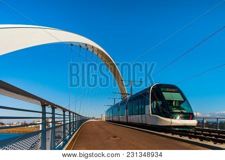 Tram Movement On The Citadelle Bridge Across Bassin Vauban For Trams And Bicycles