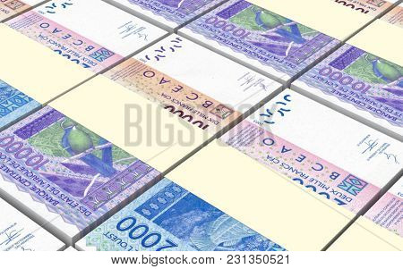 West African CFA francs bills stacked background. 3D illustration.