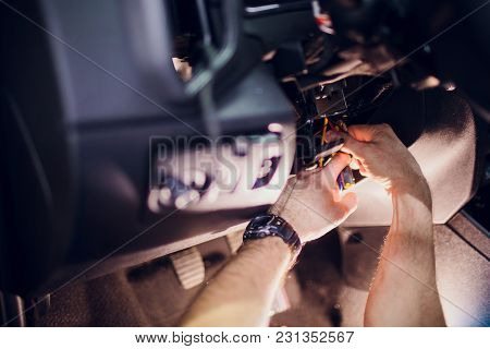 Keychain Car Security System. Installation In Car Man Hand
