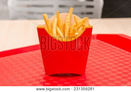 French fries in red box on a tray