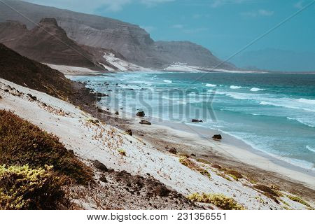 Stunning View Over Barren Rugged Volcanic Cliffs And Sand Dunes. Vast Plain Of The Coastline. Baia D