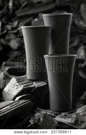 Three Matte Black Shot Glass .on Charcoal Background. Black Edition.creative.let's Drink.cheers.mock