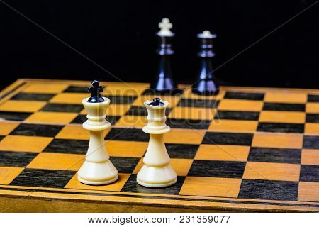 Chess Board With Cash And Chess On A Dark Background