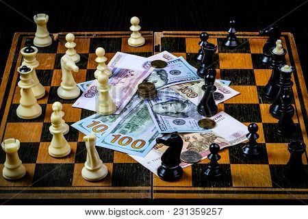 Chess Board With Cash And Chess On A Dark Background