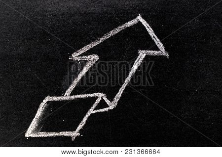 White Chalk Hand Drawing In Uptrend Arrow Shape On Blackboard Background