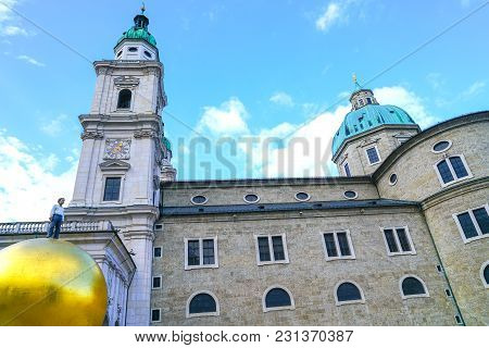 Salzburg Austria - September 6 2017; Large Golden Sphere With Man On Top By Sculpture By Artist Step