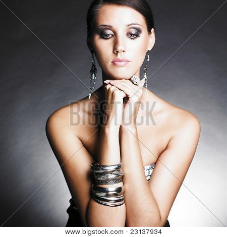 Beautiful woman with evening make-up. Jewelry and Beauty. Fashion photo