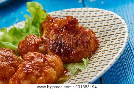 Crispy Buffalo Fried Cauliflower -  Battered Cauliflower Tossed In Garlicky Buffalo Sauce.