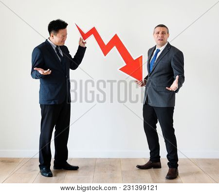 Businessmen with  decreasing symbol