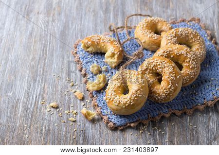 Traditional Greek Easter Biscuits Paskhalina Kuluria With Sesame Seeds On A Wooden Table, Selective 