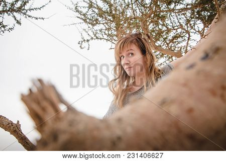 Pretty Girl Have Fun On A Tree In The Desert In A Day