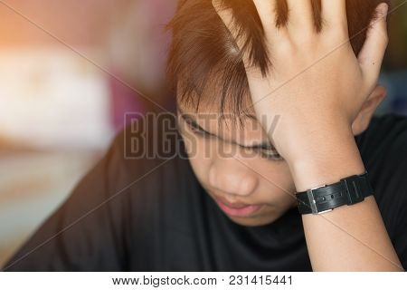 Education Test Concept : Asian Boy Student Studying Stressed Headaches For Exams In Classroom, Learn