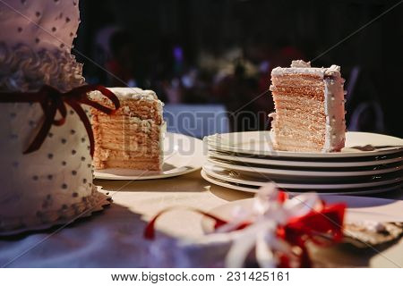 A Piece Of An Apetic Wedding Cake On A Plate
