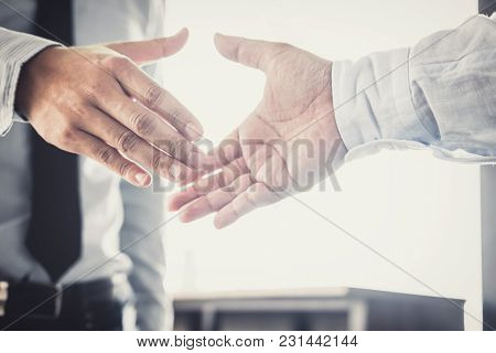 Handshake After Good Cooperation, Two Businessman Handshake After Discussing Good Deal Of Trading Co