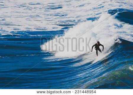 Sydney, Australia - July 4th, 2013: Surfers Riding Big Waves In Bondi Beach In Sydney During The Aus