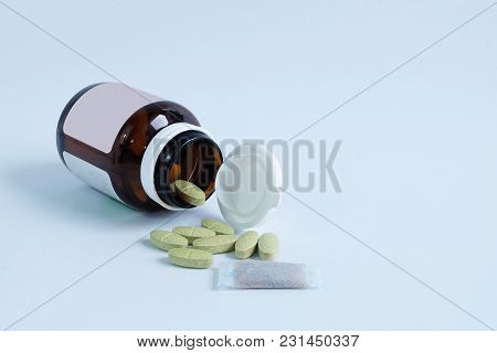 Vitamin And Bottle And Dry Desiccant, Silica Gel In Bag