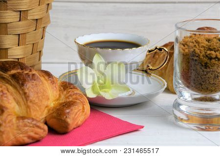 Vintage Coffee Cup With Espresso On A Saucer, Croissant On The Rose Table-napkin And Another One Beh