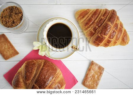 Vintage Coffee Cup With Espresso On A Saucer, Croissant On The Rose Table-napkin And Some Biscuits ,