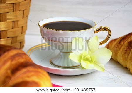 Vintage Coffee Cup With Espresso On A Saucer, Croissants, Item Of Basket, Green Tender Orchid Flower