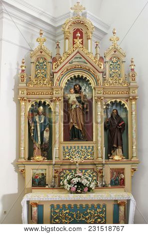 SISAK, CROATIA - DECEMBER 07: Altar of Saint Joseph in the Church of Holy Cross in Sisak, Croatia, on December 07, 2017.
