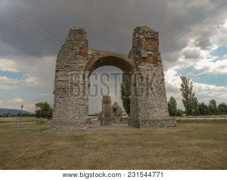 Cloudy Sky Over Old Roman Gate Heidentor At Carnuntum, Austria Europe