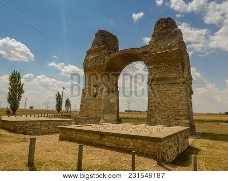 Cloudy Sky Over Old Roman Gate Heidentor At Carnuntum, Austria Europe