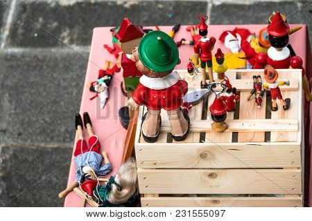 Pinocchio And Other Puppets In A Street Market