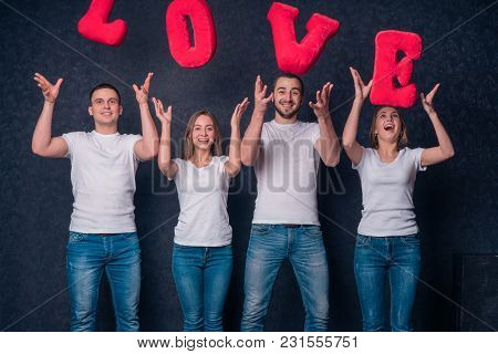Courting Couples Throw Up In The Air The Letters Of The Word Love