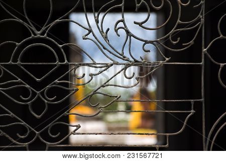 Curved Steels Window On Ubosot And Three Buddha Brother Statue Of Wat Phra Borommathat Chaiya Temple