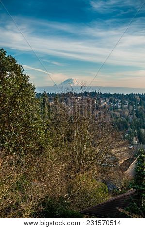A Veiw Of Mount Rainier And Wispy Clouds. Photo Taken In Burien, Washington.