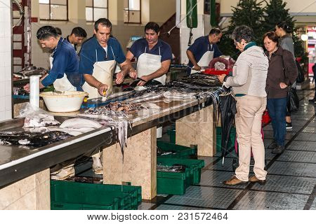 Funchal, Portugal - December 10, 2016: Buyers And Sellers Of Seafood And Fish In The Funchal Fish Ma
